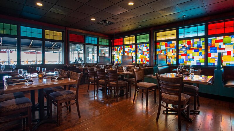 Indoor dining area with tables and booths