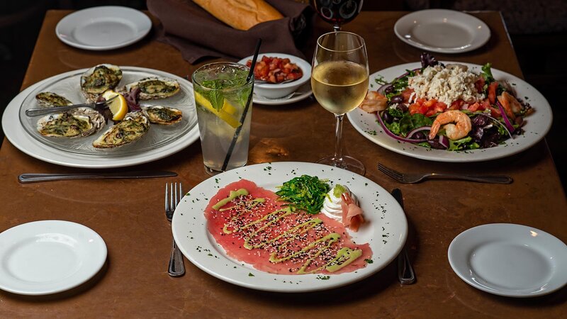 Three plated appetizers with focus on tuna