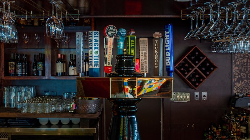Indoor bar with focus on beer taps