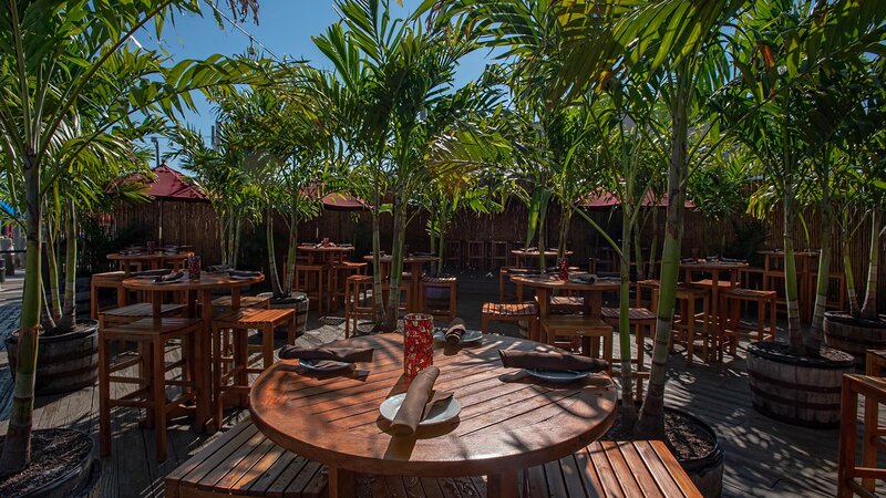 Outdoor dining area with focus on high top table